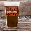 Never Underestimate Clear Pint Glass - Color Printed (single) ALT1 Thumbnail