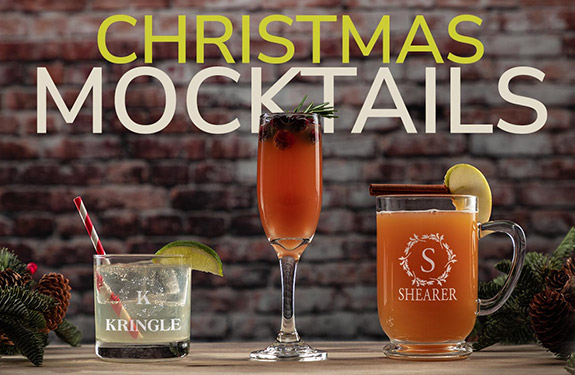 christmas mocktails with fancy garnishes in a rocks glass, champaign flute and clear glass mug